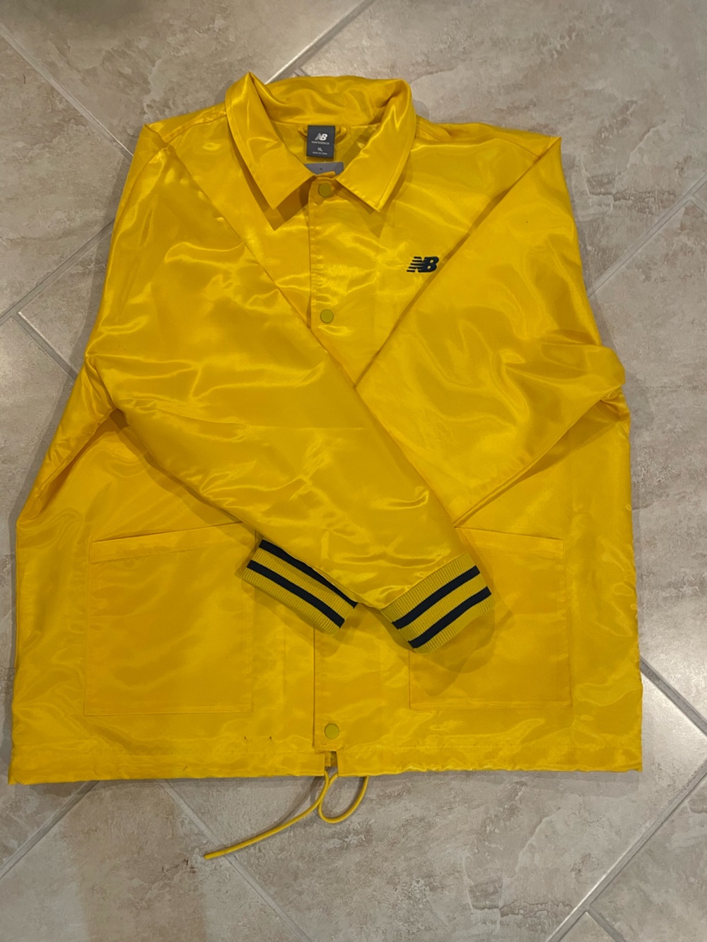New Balance Yellow mens' Coach Jacket with Navy Trim